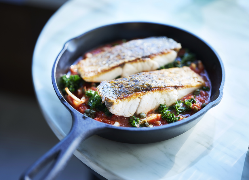 Pan fried barramundi with calamari, tomato and capers