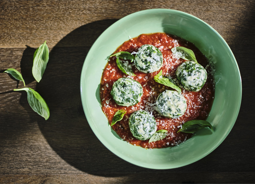 Spinach and ricotta gnudi (gnocchi) with tomato and basil