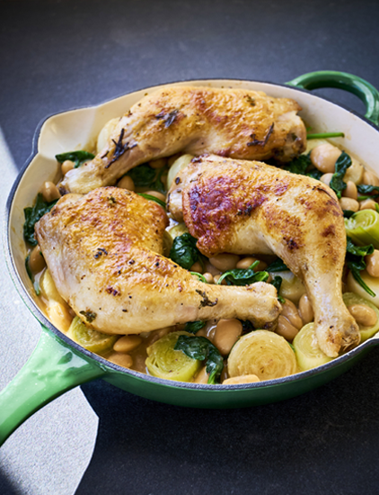 Roasted chicken with butter beans, leeks and baby onions